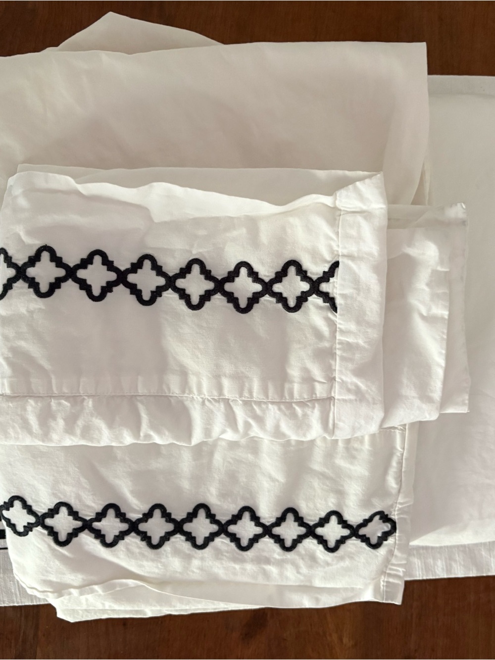 White Pillowcases with Black Embroidered Trellis Border